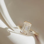 Load and play video in Gallery viewer, 2.5CT Emerald Cut Lab Grown Diamond Engagement Ring: Half Bezel, IGI Certified