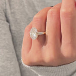 Load and play video in Gallery viewer, 5 Carat Oval and Tapered Baguette Three Stone Ring in 14k Yellow Gold: Lab Grown Diamond Engagement Ring