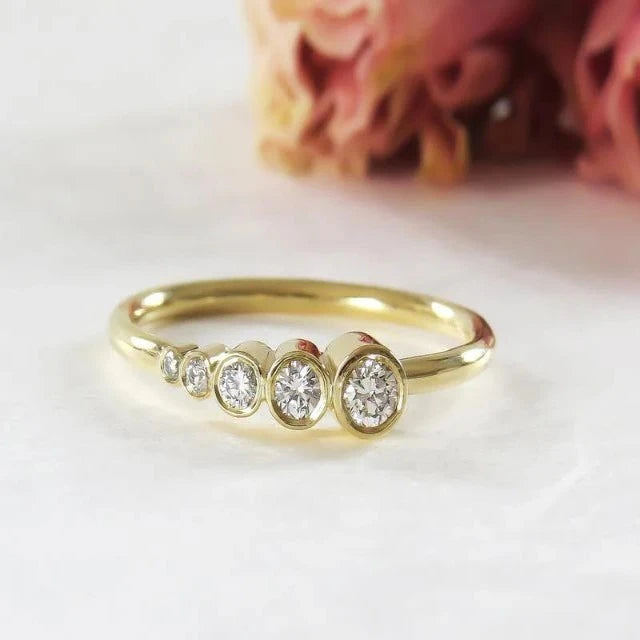 YELLOW GOLD FIVE STONE ASYMMETRIC BEZEL SET MOISSANITE DIAMOND WEDDING RING BAND