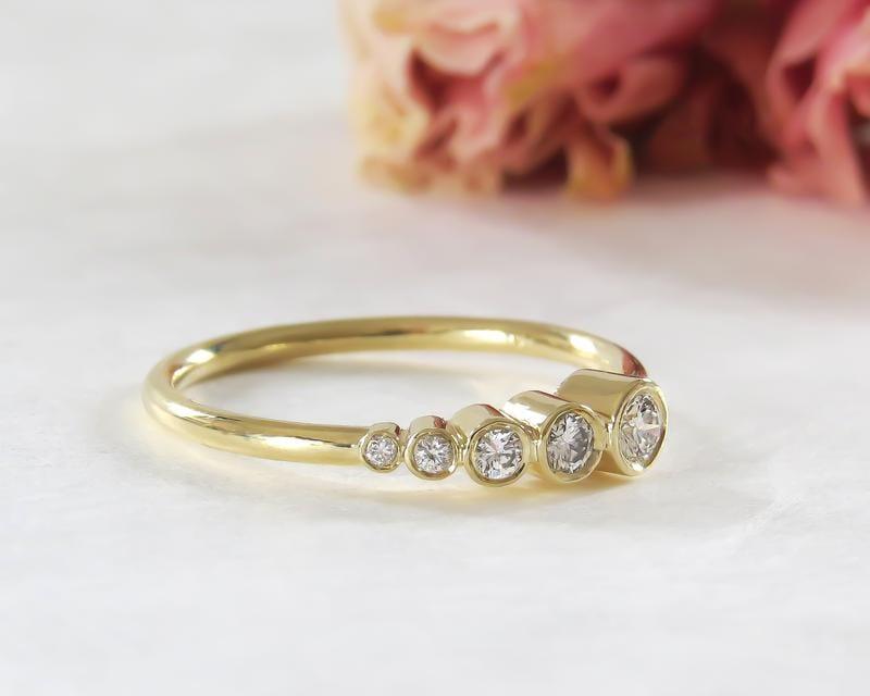 YELLOW GOLD FIVE STONE ASYMMETRIC BEZEL SET MOISSANITE DIAMOND WEDDING RING BAND